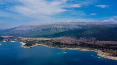 Panoramic aerial view of the massive, layered slopes of Mount Dinara Stock Photos
