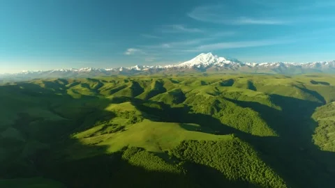 Panoramic aerial view of Mount Elbrus, the highest peak in Europe, surrounded by Stock Footage 325812966
