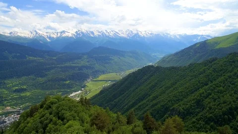 Panoramic aerial view of mountain with cloud and town in valley 스톡 동영상 94771437