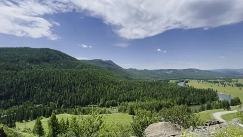 Panoramic aerial view of a mountain valley with a meandering river. Video stock 247664135