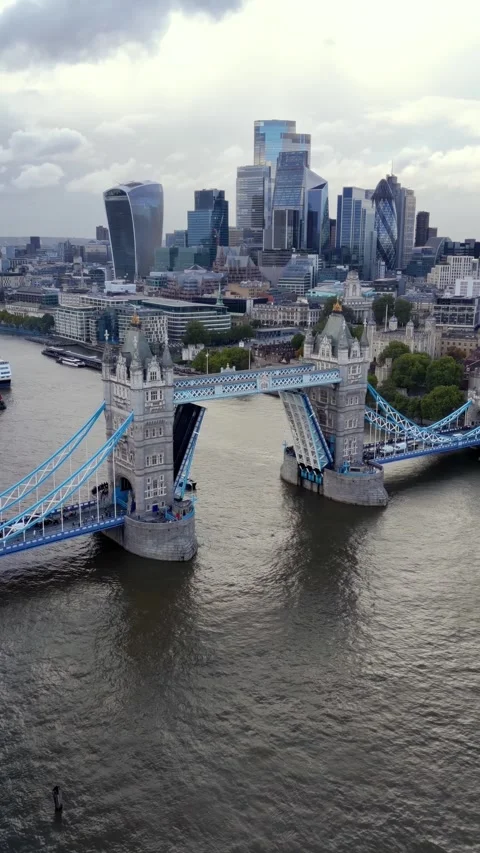 Panoramic aerial view of the open lifted Tower Bridge of London Stock Footage 310835668