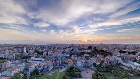 Panoramic aerial view over Rooftops of Porto's old town on a warm spring even Fotos Stock