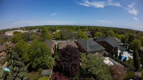 Panoramic aerial view overlooking a leafy green suburban housing neighborhood 스톡 사진