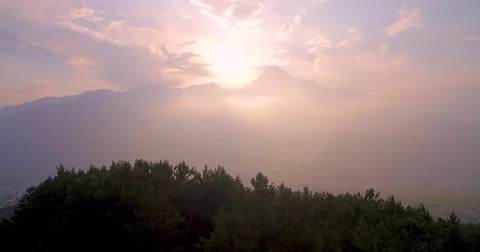 Panoramic aerial view of  pink sunset in  mountains Kazbek and villages below 스톡 동영상 83160216