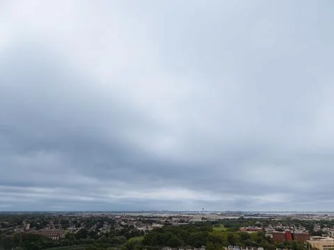 Panoramic aerial view of Queens rooftops, homes and tree-lined Jamaica area stre Фото