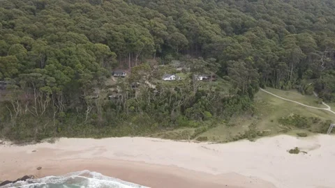 Panoramic aerial view of remote beach eco cabins Stock Footage 336020457