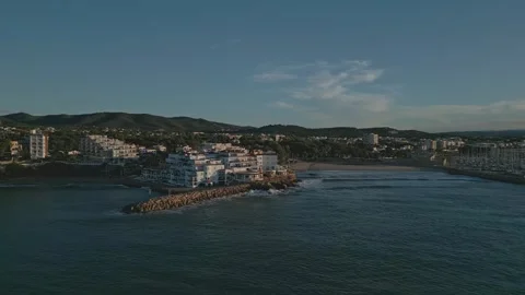Panoramic aerial view of Roc de Sant Gaieta coastal village and surroundings Stock Footage 263061504