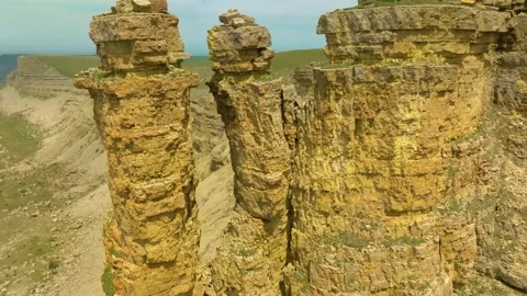 Panoramic aerial view of the Two Monks rocks on the Bermamyt plateau, North Cauc Stock Footage 325813463
