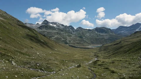 Panoramic aerial view of Val Loga - View on Montespluga Lake Town Pizzo Suretta Stock Footage 253500243