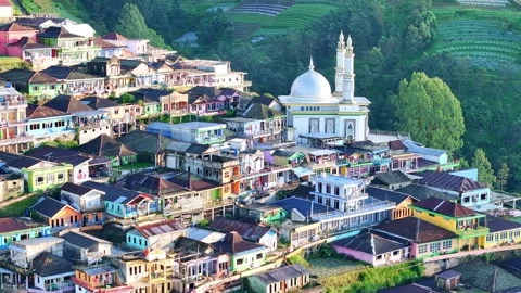 Panoramic aerial view of a vibrant mountain settlement in Java, Indonesia, with Stock Footage 321740475