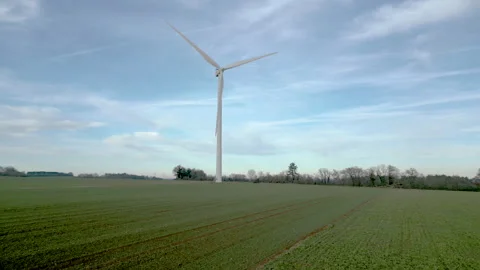 Panoramic aerial view of wind farm turbines rotating in January landscape. Stock Footage 296187432