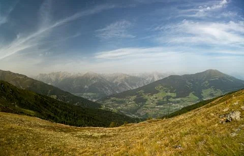 Panoramic Alpine Mountain Valley Landscape With Green Meadows, Forests and .. Stock Photos