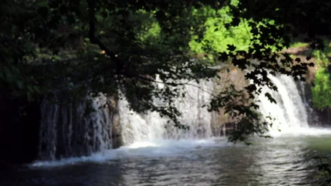 Panoramic and focus on waterfall in the woods with sound - 4K - ProRes Stock Footage 155391969