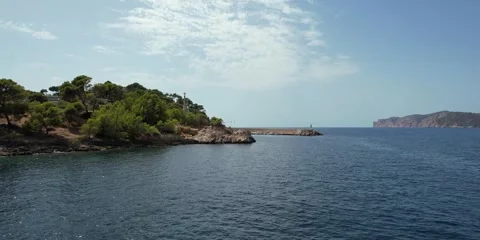 Panoramic bay including cross Majorca Spain Europe: Santa Ponsa aerial Stock Footage 346290153