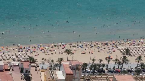 Panoramic of a beach with people bathing Stock Photos