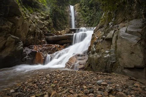 Panoramic beautiful deep forest waterfall in Indonesia 写真素材