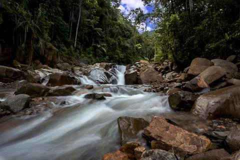 Panoramic beautiful deep forest waterfall in Indonesia Stock Photos