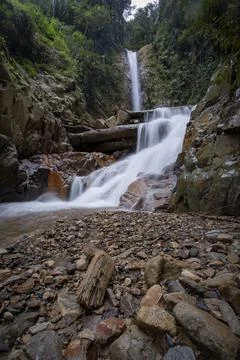 Panoramic beautiful deep forest waterfall in Indonesia Stock Photos