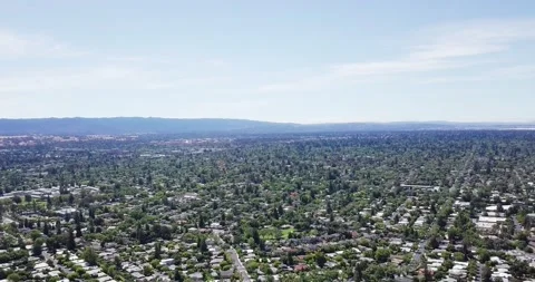 Panoramic birds eye view of silicon valley suburbs with mountains in Stock Footage