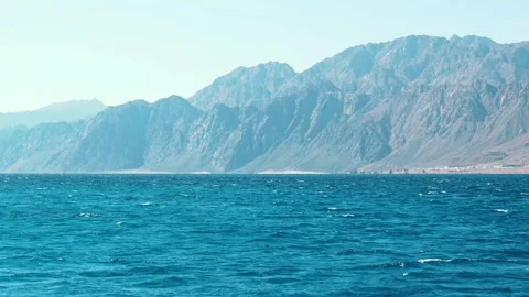 A panoramic blue nature landscape of mountain and ocean Stock Footage 329236847