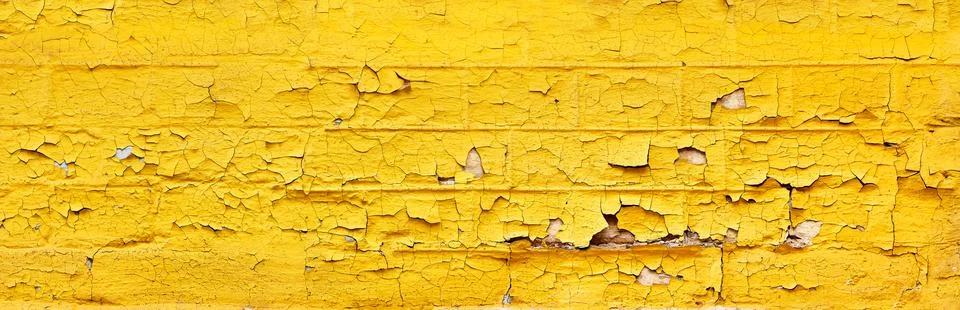 Panoramic brick wall with old paint flakes peeling Stock Photos