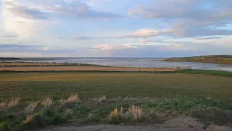 Panoramic of Budle Bay at dusk Stock Footage 321462396