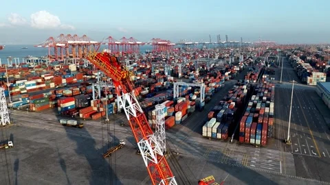 Panoramic of Busy Container Port with Cranes and City Skyline Aerial View Stock Footage 317209912