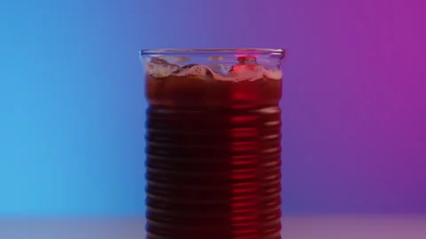 Panoramic camera move on a beautiful ribbed glass with cocktail of iced coffee Stock Footage 246477032