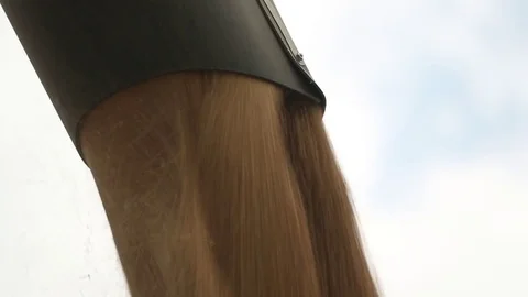 Panoramic camera movement from top to bottom, from the auger tube of the combine Stock Footage 74480433