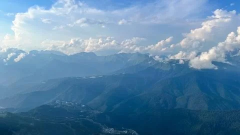 Panoramic Caucasus mountain range under dramatic summer clouds Stock Photos