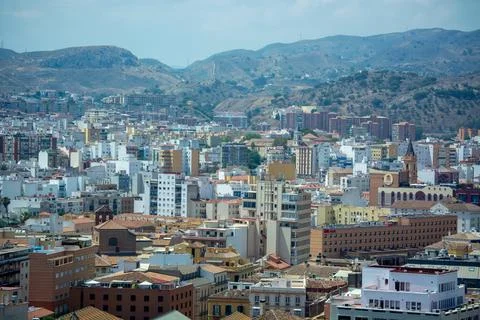 Panoramic city view with mountains in the background Stock Photos