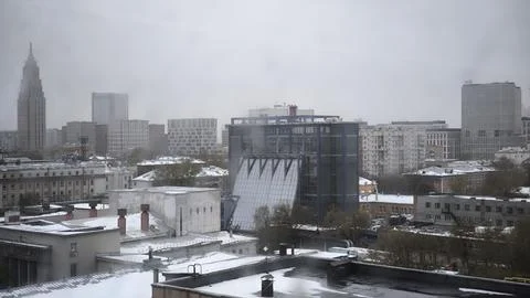 Panoramic city view under overcast gray sky in winter season. 库存照片