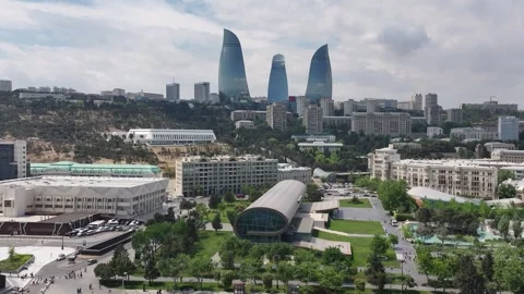 Panoramic Cityscape: Modern Architecture and Green Spaces in Urban Setting Stock Footage 341893856