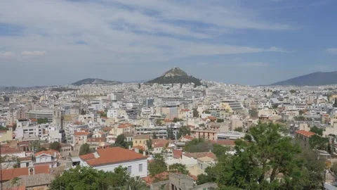 Panoramic cityscape view of Athens with Lycabettus Hill. panning shot Video stock 340541649