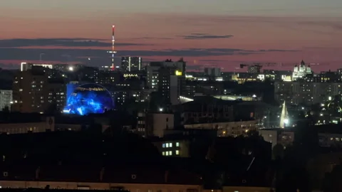 Panoramic cityscape from window at summer sunset Stock Footage 310446793