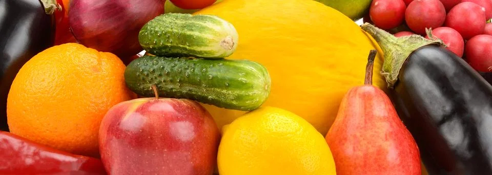 Panoramic close up background of mixed fresh organic vegetables and fruits .. Stock Photos