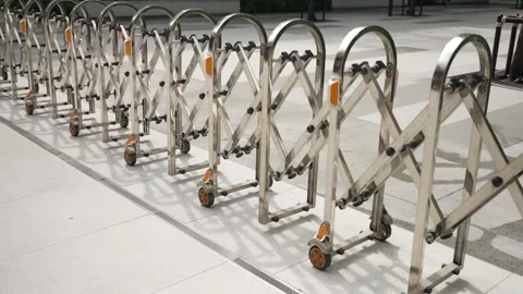 Panoramic close up of closed retractable stainless steel rolling barrier at the Stock Footage 310756969