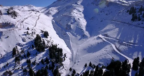 Panoramic close up of early first snow at slopes around ski resort Stock Footage 93486066