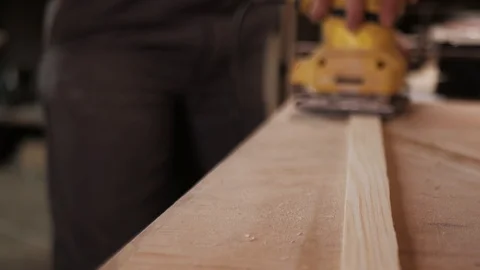 Panoramic close shooting of manual grinding process in carpenter's hand. Stock Footage 110354121