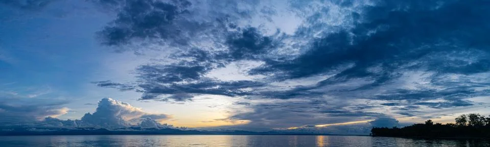 Panoramic of Cloud Formations over Mountains in Background Stock Photos