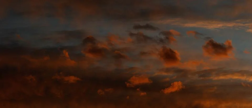 Panoramic cloudscape late red sunset Stock-Fotos