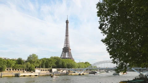 A panoramic commercial view of the Eiffel Tower over the Seine River in Paris, f Stock Footage 336363051