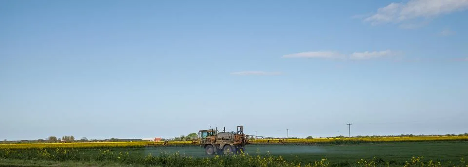 Panoramic crop spraying Stock Photos