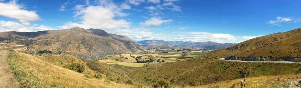 Panoramic Crown Range Road view in Otago, New Zealand - Majestic alpine mou.. Stock Photos