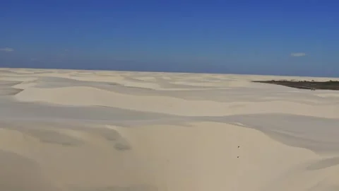 Panoramic desert dunes under blue sky - Lencois Maranhenses, Brazil Stock Footage 331516948