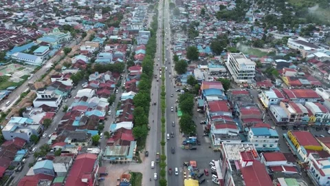 Panoramic drone flight capturing the dynamic energy of a tropical city's Video stock 325201456