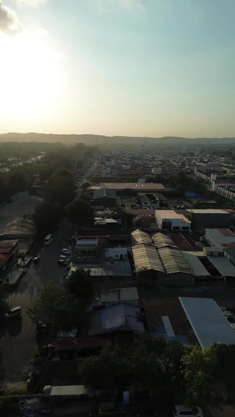 Panoramic drone flight showcasing a sprawling community against a luminous,.. Video stock 339038606