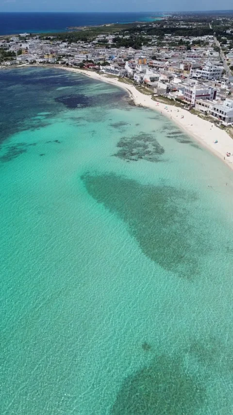Panoramic drone footage of Torre Lapillo, Italy Stock Footage 317905169
