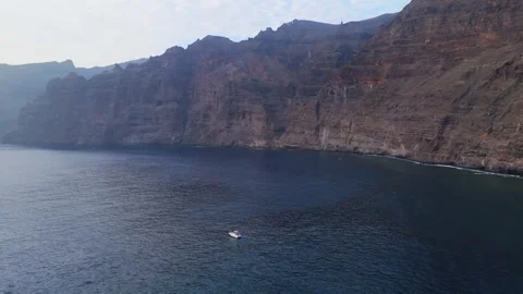 Panoramic Drone Orbit Around Yacht with Los Gigantes Cliffs, Tenerife, 4K Stock-Footage 314735330