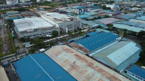 Panoramic drone perspective showcasing a sprawling modern industrial comple.. Video stock 339036193